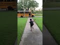 Видео - Little Boy Falls Onto Grass While Running to Catch School Bus